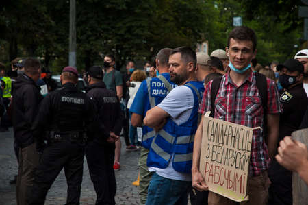 KYIV, UKRAINE - AUGUST 13, 2020: Activist near the embassy of Belarus in Kyiv in support for protests with anti-violence slogans posterのeditorial素材