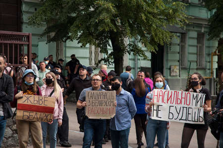KYIV, UKRAINE - AUGUST 13, 2020: Activists holding protest slogans during a rally in support of the protests in Belarus near the Embassy of Belarus in Kyiv demand the resignation of Lukashenkoのeditorial素材