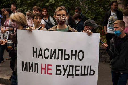 KYIV, UKRAINE - AUGUST 13, 2020: Activist holding protest poster with inscription "You will not be sweet forcibly" in support of the protests in Belarus near the Embassy of Belarus in Kyiv demand theのeditorial素材