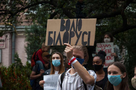 KYIV, UKRAINE - AUGUST 13, 2020: Activist holding protest poster with inscription "Freedom for Belarus" during a rally in support of the protests in Belarus near the Embassy of Belarus in Kyivのeditorial素材