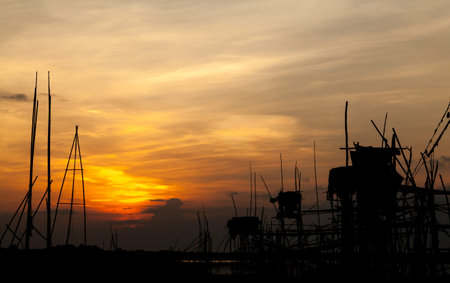 Silhouette Tree and Longtail boat in the morning at railay thailandの写真素材