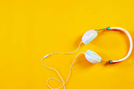 The music headphones on the orange backgroundの写真素材