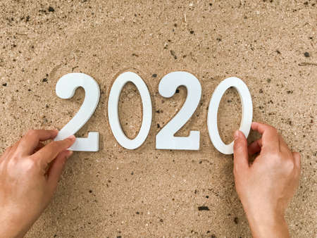 2020 numbers on the sand, happy new yearの写真素材
