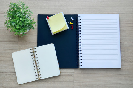 Background blank notebook on the wood table - Top viewの写真素材