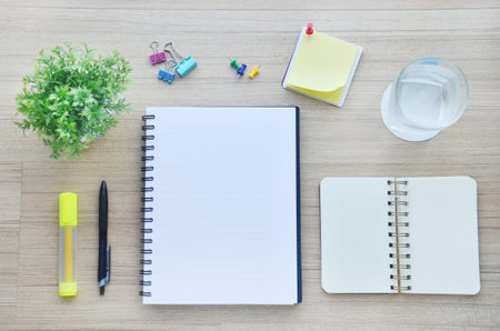Background : blank paper and office tools on the wood table - Top view