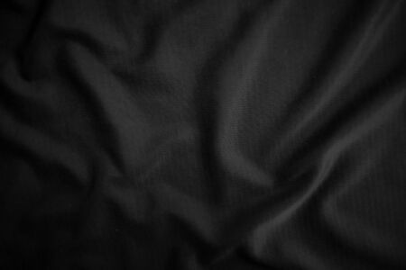 Background texture black cloth. Abstract dark wavy soft. Fabric is wrinkled. Fashion luxury style.の写真素材