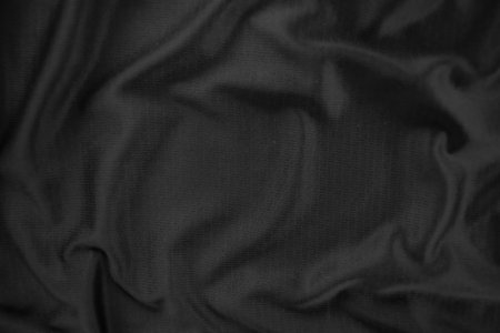 Background texture black cloth. Abstract dark wavy soft. Fabric is wrinkled. Fashion luxury style.