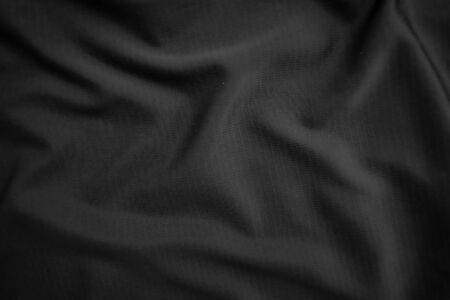 Background texture black cloth. Abstract dark wavy soft. Fabric is wrinkled. Fashion luxury style.の写真素材