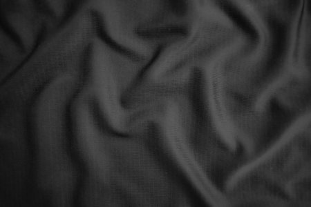Background texture black cloth. Abstract dark wavy soft. Fabric is wrinkled. Fashion luxury style.