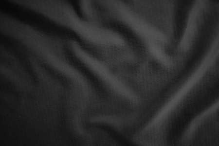 Background texture black cloth. Abstract dark wavy soft. Fabric is wrinkled. Fashion luxury style.の写真素材