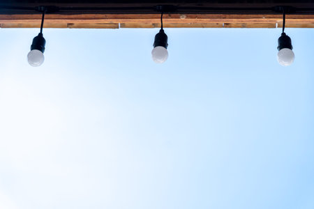 long Light bulbs with beautiful blue sky.