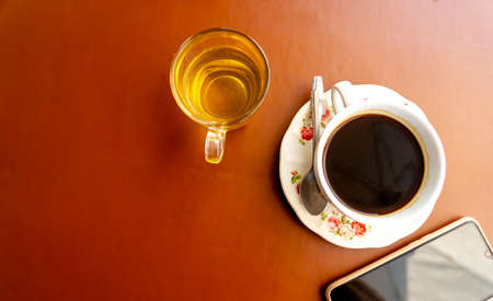 Hot coffee and tea in cup on table.の写真素材