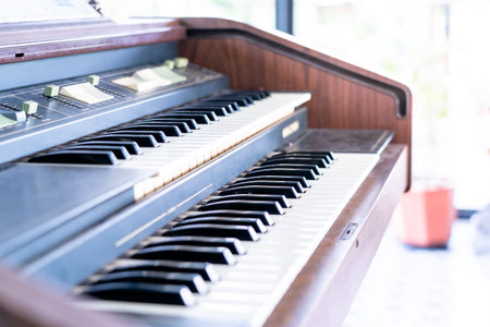 Female pianist hands on grand piano keyboard.