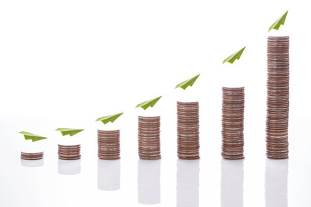 The financial concept Money coin graph  bull market with green planeの写真素材