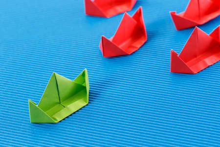 Paper boat in ocean. Blue ocean marketing concept.の写真素材