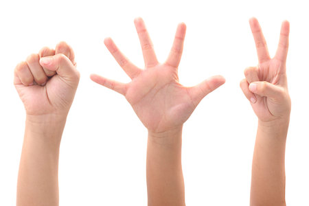 Rock paper scissors. kid hand on whtie background