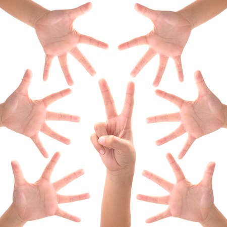 Rock paper scissors. kid hand on whtie backgroundの写真素材