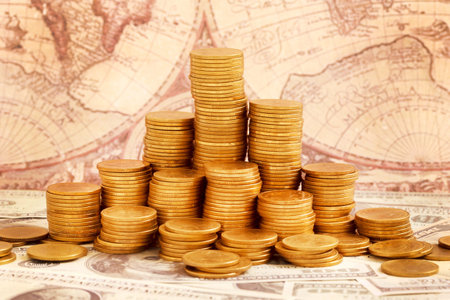 Gold Coins on Vintage Map Background.