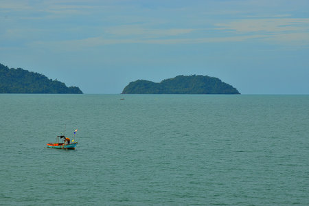 Fishing Boat in the Sea with fishermanの写真素材