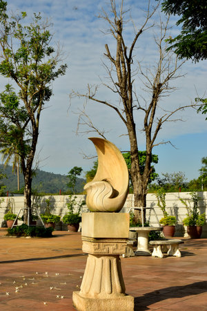 The White Stone Sculture in the garden with Dried Treeの写真素材