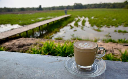 A cup of Coffee with art design in the Morning Viewの写真素材