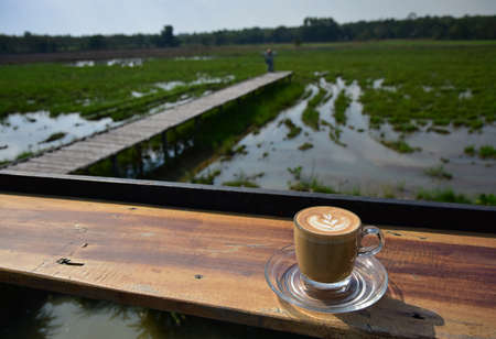 A cup of Coffee with art design in the Morning Viewの写真素材