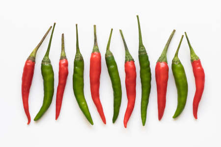 Red and green chili pepper on a white backgroundの写真素材