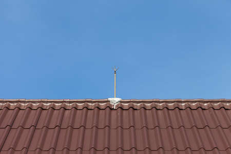 Lightning rod on a roofの写真素材