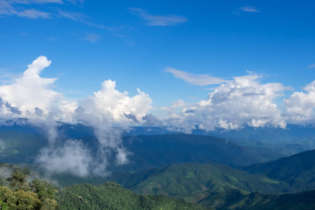 Green hill and blue sky scene view in Nan province, Thailandの写真素材