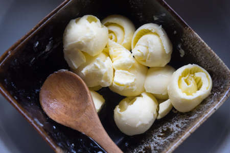 Butter for bread or toast on a wooden bowlの写真素材