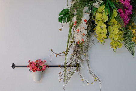 fake flowers decorate on white wallの写真素材