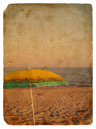 Seascape with umbrella. Old postcard, design in grunge and retro styleの写真素材