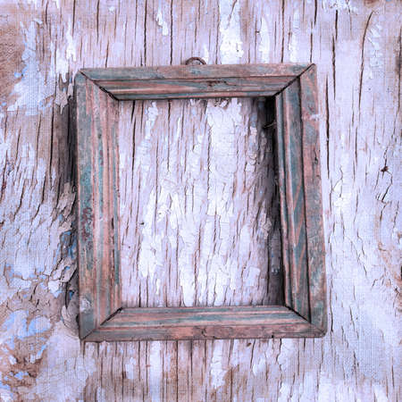 Retro photo frame on the cracked wall  Page to design photo booksの写真素材