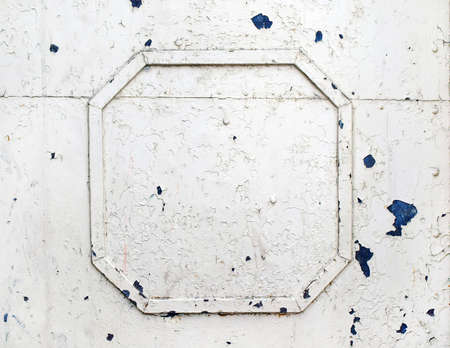 Painted metal surface with metal frame of old white paint craquelureの写真素材