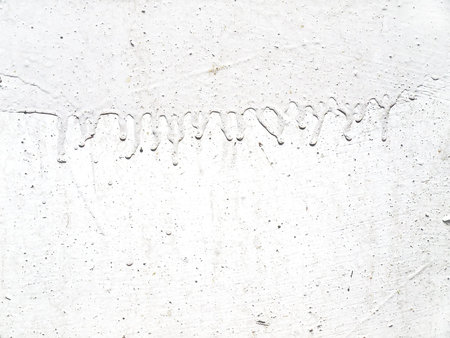 Surface with white paint and dirty smudgesの写真素材