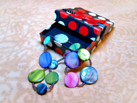 Bright, beautiful female accessory made of natural pearl in a gift boxの写真素材