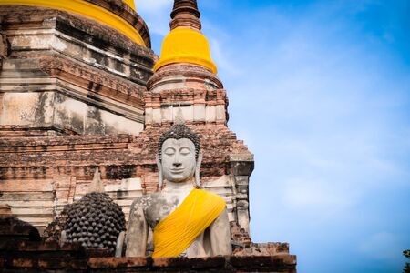 The Buddha statue and ancient remains in the Thailandの写真素材
