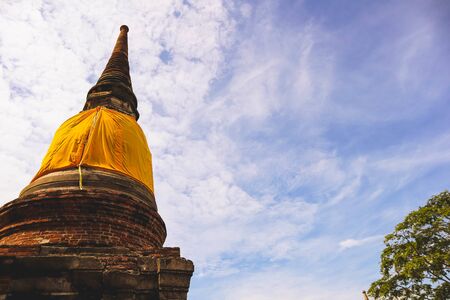 The Buddha statue and ancient remains in the Thailandの写真素材