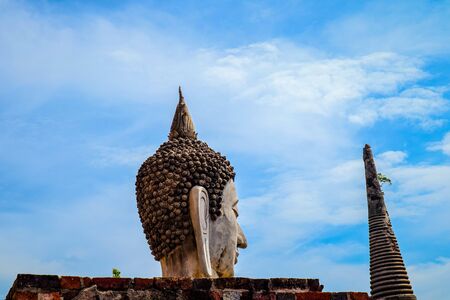 The Buddha statue and ancient remains in the Thailandの写真素材