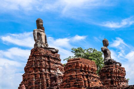 The Buddha statue and ancient remains in the Thailandの写真素材