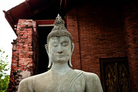 The Buddha statue and ancient remains in the Thailandの写真素材