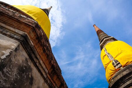 The Buddha statue and ancient remains in the Thailandの写真素材
