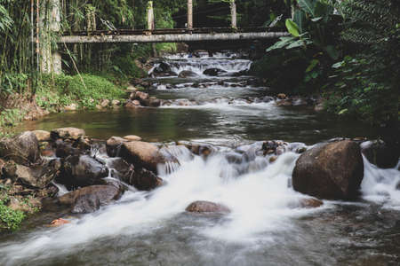 Watercourse in natural with water and rocks.の写真素材