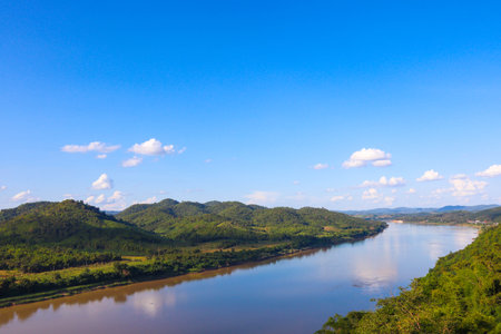 Natural landscape of Mekong River is a muddy color flowing through the mountains, is the border between Thailand and Laosの写真素材