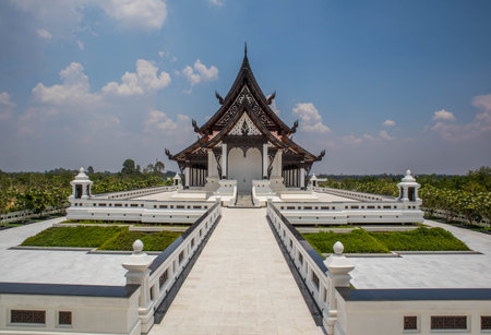 Pagoda Wat Pa Ban Tat temple, Gold temple with beautiful cloudy in Udon Thani Thailand.の写真素材