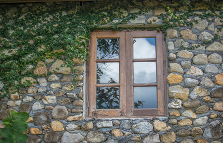 On the old window of the stone building for security