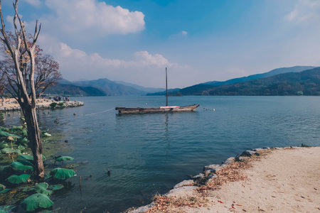 An old boat floating lonely on calm water