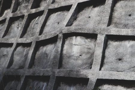 Architectural Reinforced Concrete Structure Showcasing Depth, Symmetry, and Urban Designの写真素材