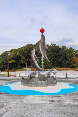 Dolphin statue in front of  Marine World umino-nakamichi Fukuokaの写真素材