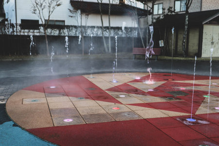 Geometric Splash Pad Emitting Mist and Water Jets for Outdoor Recreationの写真素材